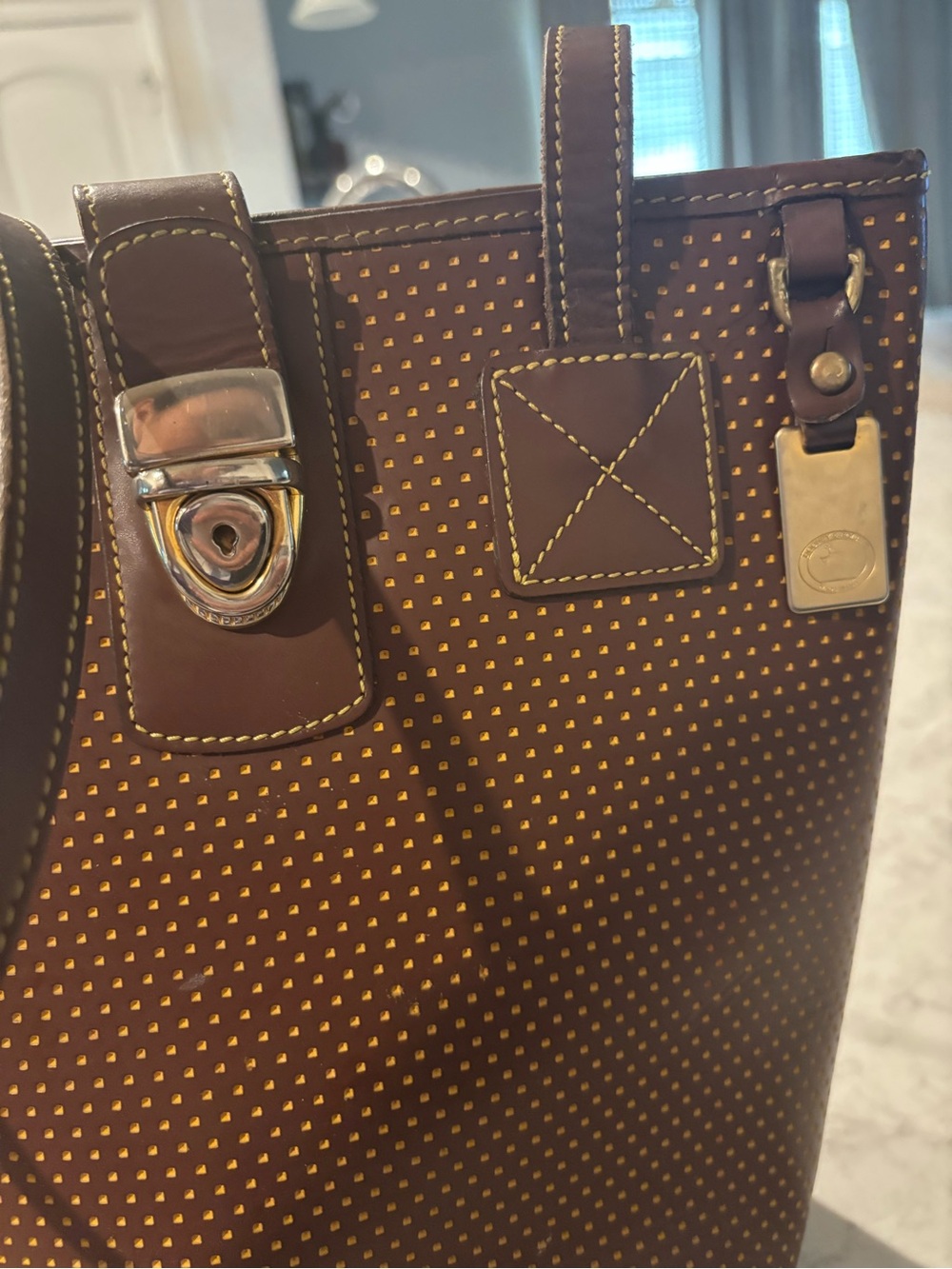Dooney & Bourke Brown and Gold Tote with Stud Detail